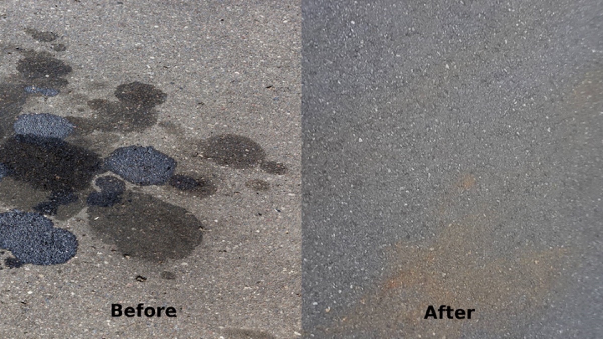 Oil stain on a driveway surface before treatment and sealing